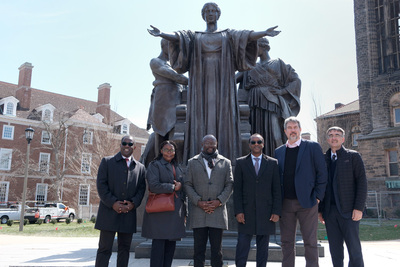 Members of a visiting delegation from the University of Pretoria pose for a group photo in front of Alma on March 20.