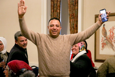 A participant celebrates after finishing the last break-out session in the Amideast Egypt Study Tour on Feb. 14 inside the Illini Union.