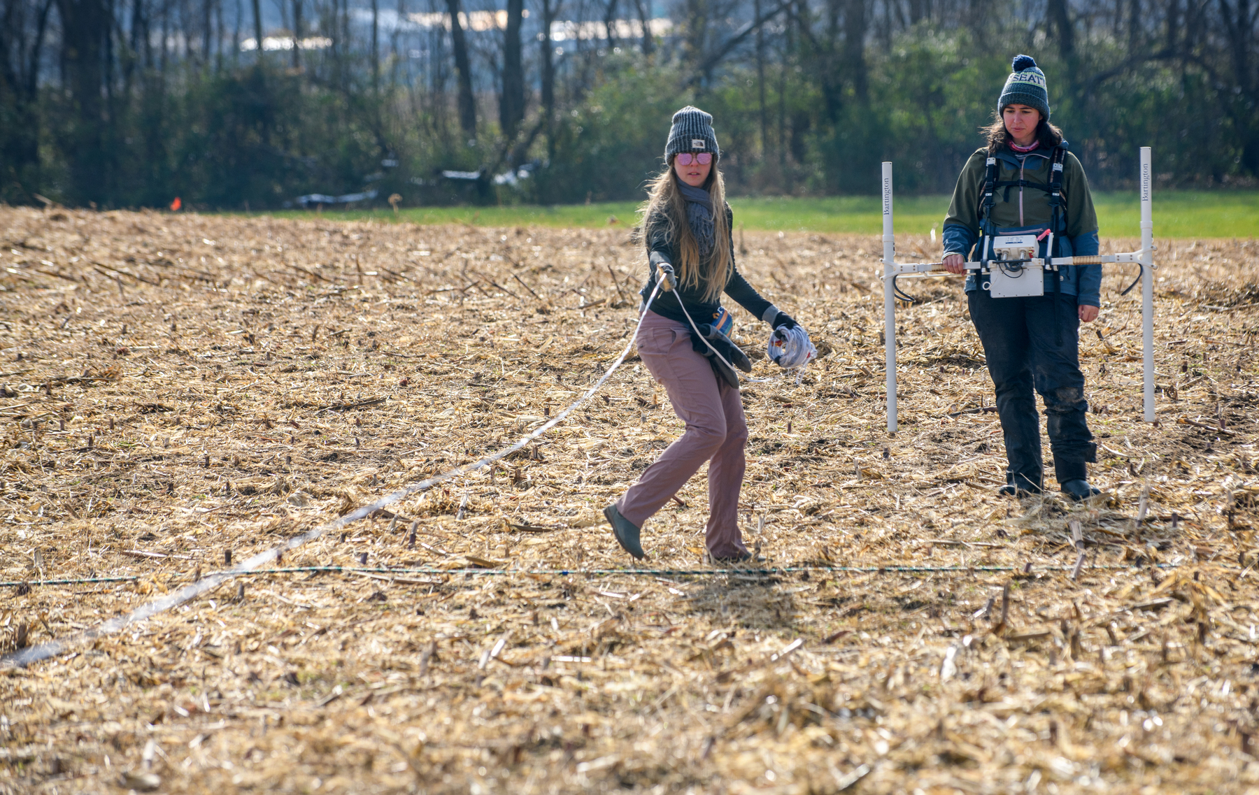 Dr. Dana Bardolph, left, of Northern Illinois University and Archaeologist Marie Meizis, right, of the Illinois State Archaeological Survey conducting gradiometer survey (courtesy Matt Dayhoff, Peoria Journal Star)