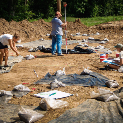 Elizabeth Watts Malouchos (left) and Alleen Betzenhauser (right) map a Mississippian structure at the Pfeffer site in the region outlying Cahokia in 2008.