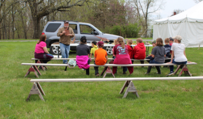 Joe Devera speaks to K-6 students