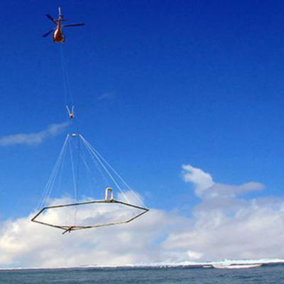 helicopter tows electromagnetic equipment over Lake Michigan