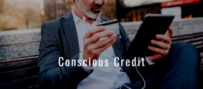 Conscious Credit text on image of man on bench with headphones in, tablet in one hand and credit card in the other