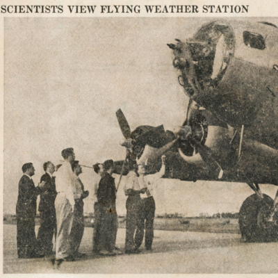 Scientists gather to inspect a B-17 plane which was turned into a weather forecasting station by the U.S. Army.