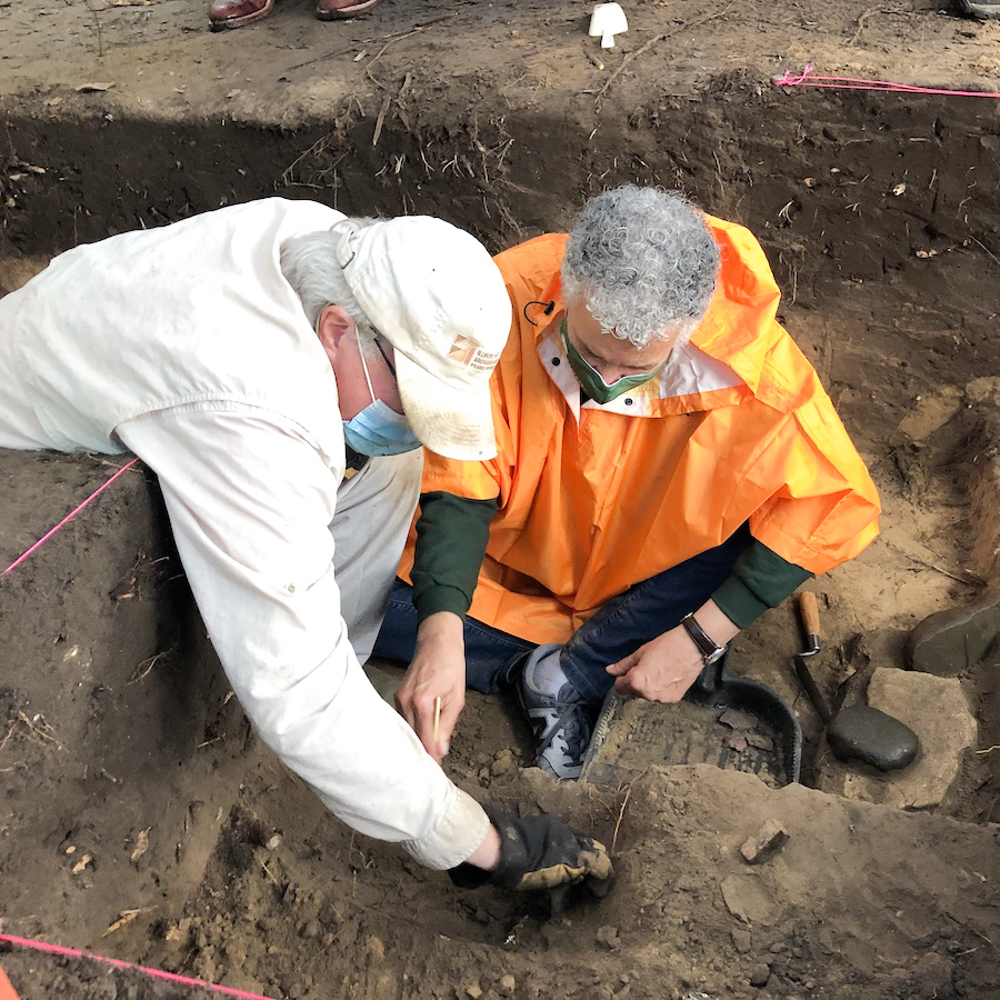 ISAS Assistant Director Thomas Loebel (Left) works with Cook County Board President Toni Preckwinkle to uncover an artifact at the Forest Preserves of Cook County (FPDCC) site , Sept. 12, 2020.