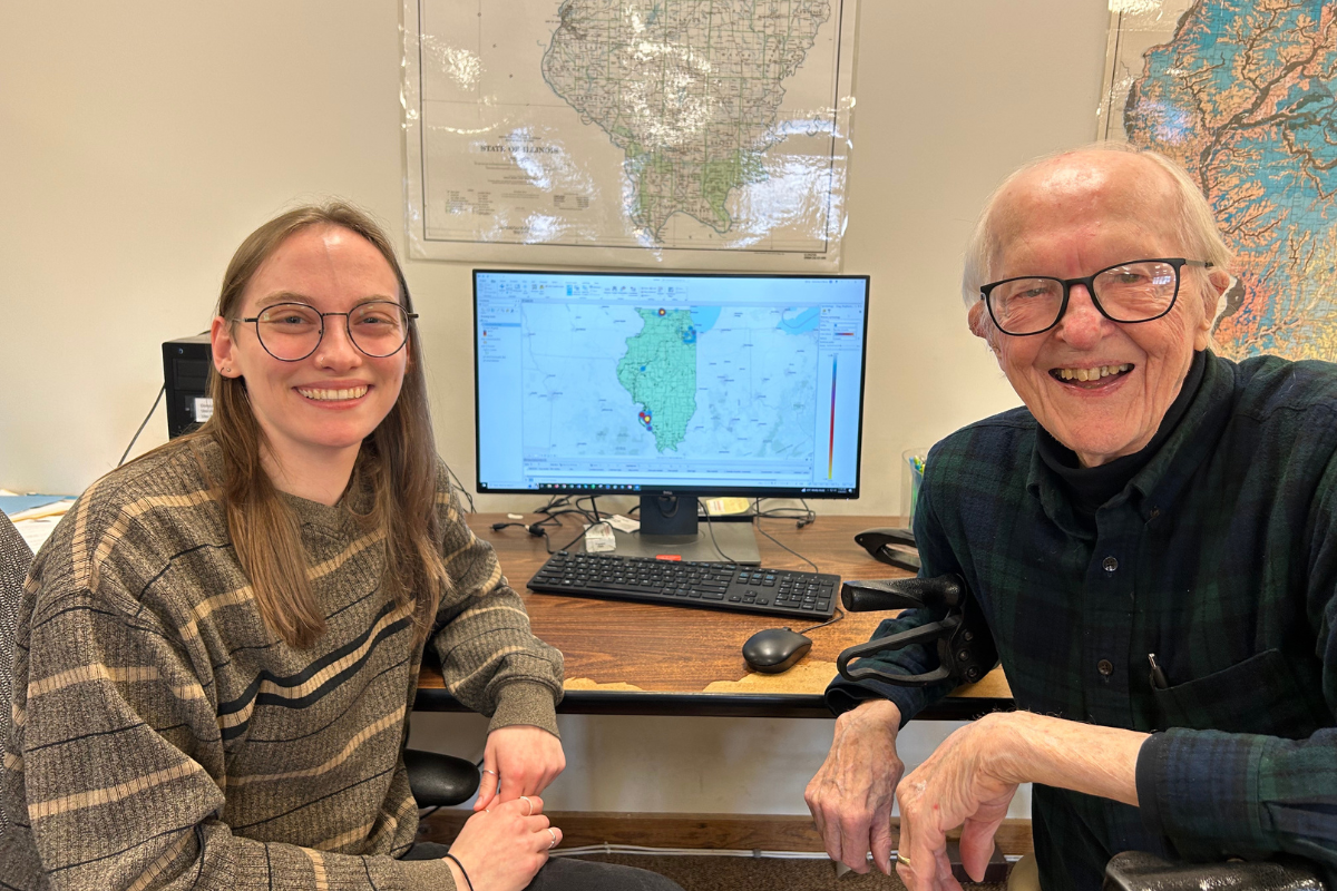 NIFS staff member Allison Densmore shows George Johnson how researchers are using his donated collections for a research project on the distribution of projectile points in Illinois. Photo credit: Clare Tolmie