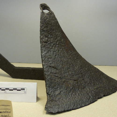 a rare intact plowshare made of hand-forged iron by an unknown blacksmith.