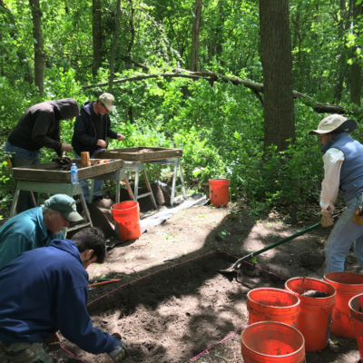 ISAS staff and volunteers work at a site in the Forest Preserves of Cook County