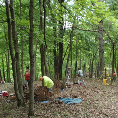 ISAS staff excavating in the woods