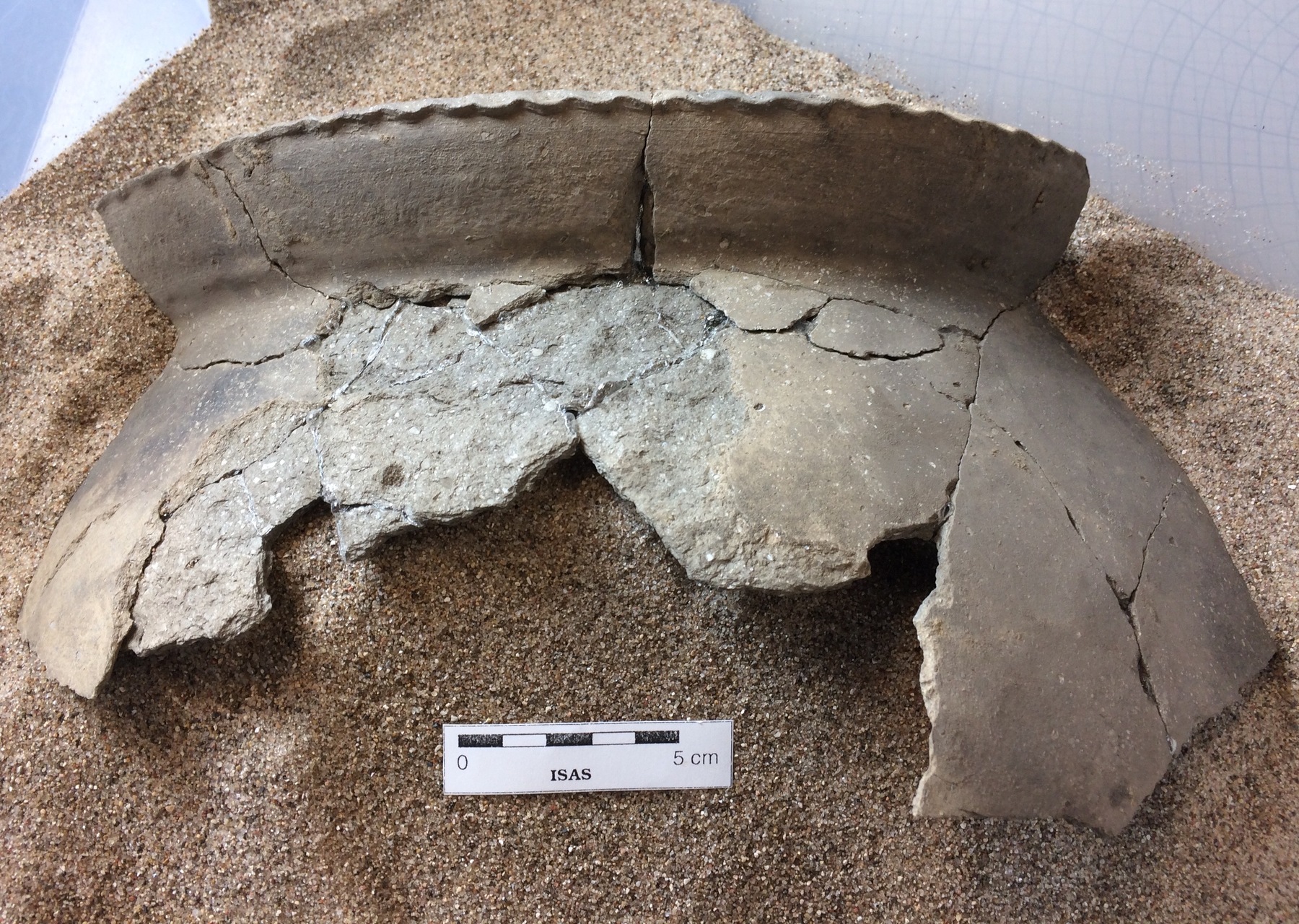 Pieces of a large ceramic vessel were found at the Cook County site and were partially reconstructed.
