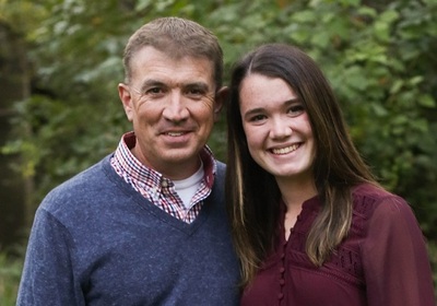 Outdoor portrait of former high school principal Jason Leahy, who now leads the Illinois Principals Association, with his daughter Emma. The first-year University of Illinois Springfield student started college with 15 credits hours by taking AP courses and tests in high school.