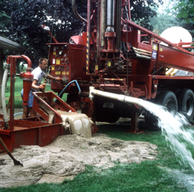 drilling team on site using a drilling rig.