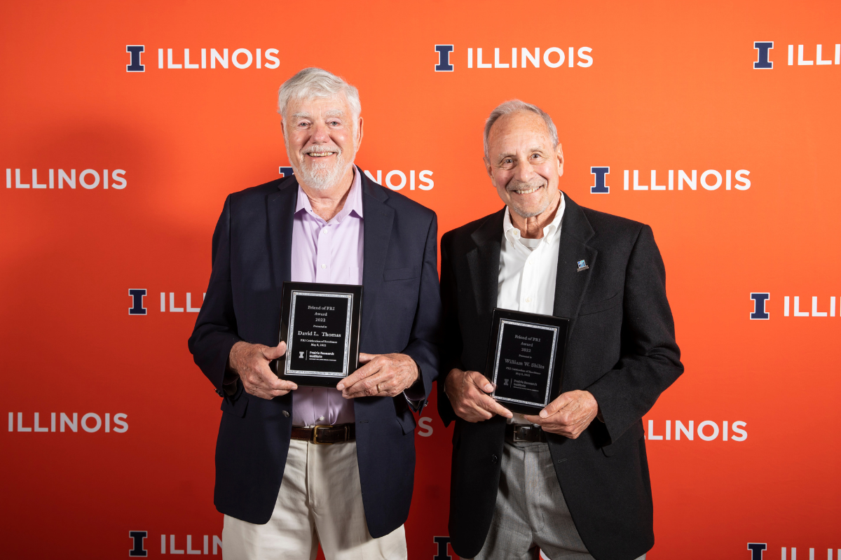 Friends of PRI honorees Dave Thomas and Bill Shilts stand with their plaque