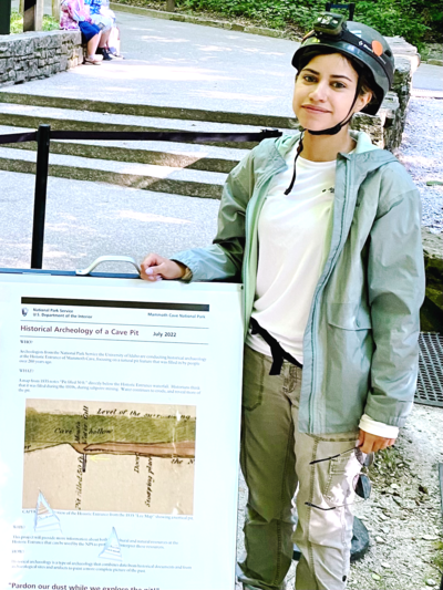 Liane Rosario holding her research poster