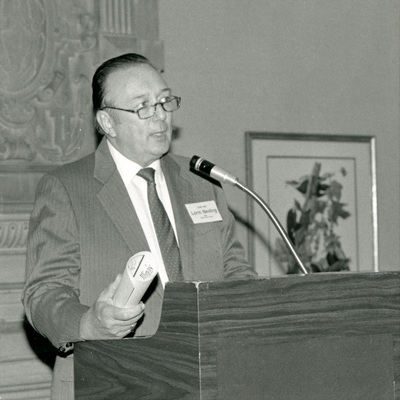Dr. Lorin I. Nevling speaking at a podium