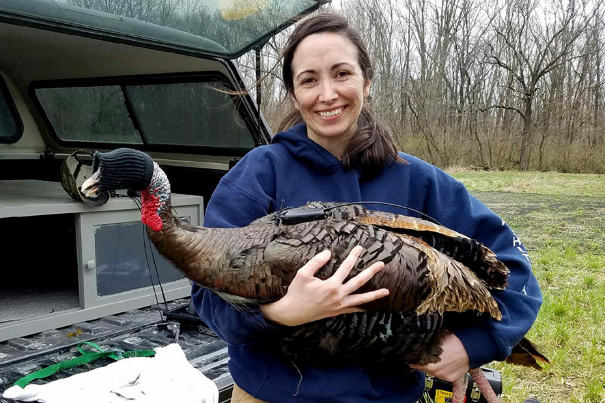 Christine Parker holding a wild turkey