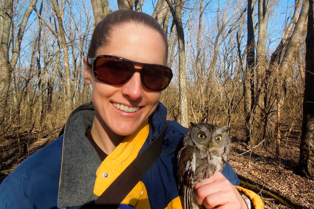 Tara Beveroth holding eastern screech owl