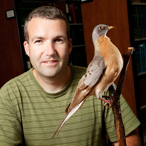 Kevin Johnson with a bird perched on his shoulder.