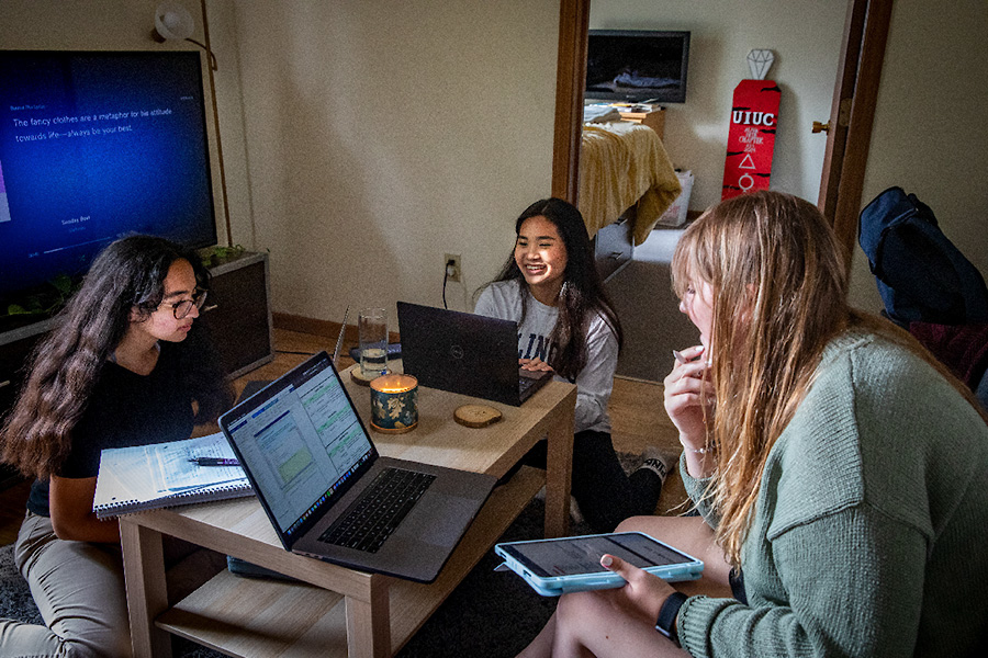 Illinois students studying in an apartment