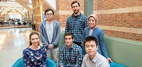 Beckman Institute's 2022 cohort of postdoctoral fellows in the Beckman lobby with three standing: (left to right): Rong Guo, Matt Lowerison, Eman Hamed and three sitting (left to right): Natalia Krawczynska, Amir Ostadi Moghaddam, Chang Cao.