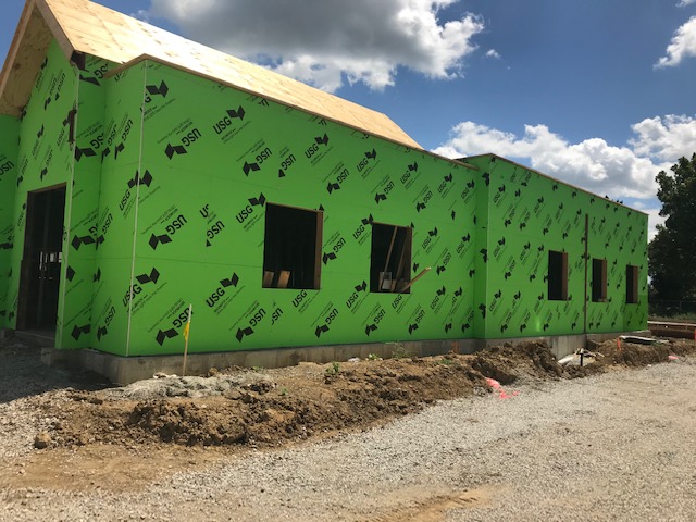 green exterior of walls of building