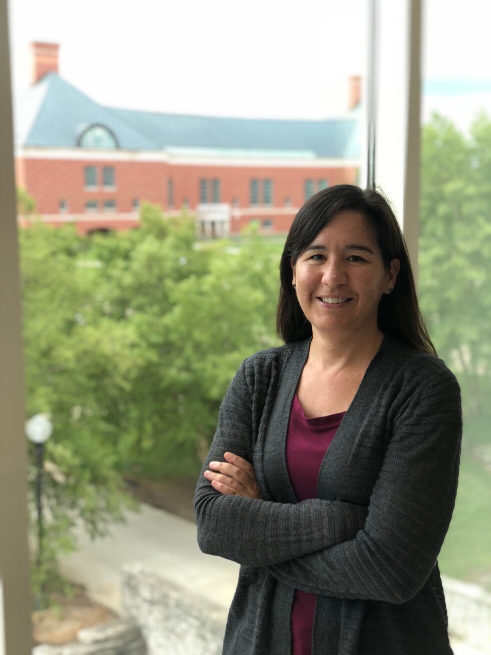 Associate Professor Shannon Sirk with the Grainer Engineering Library in the background