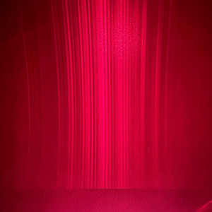 Vertical gradients of pink semiconductor laser light.