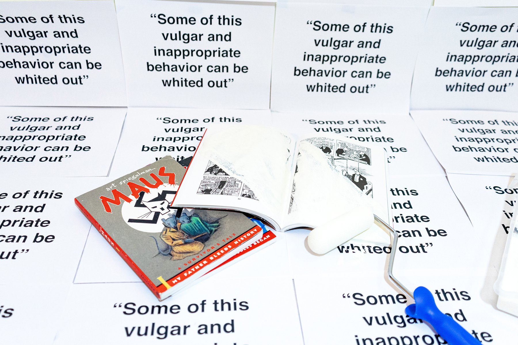 White paint writes over the pages of a book. Text repeats: "some of this vulgar and inappropriate behavior can be whited out."